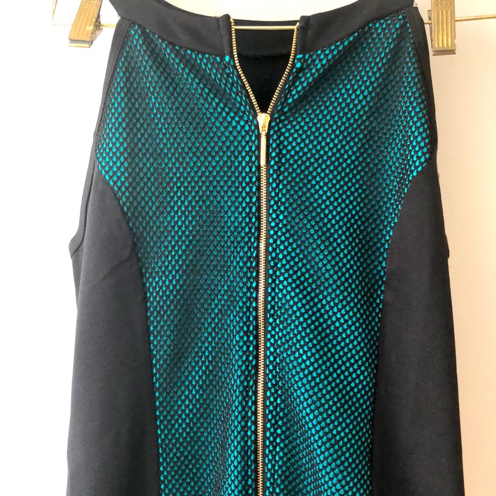 sexy green and black dress with gold zipper detail